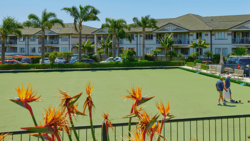 Residents enjoying the bowling green and landscaped grounds at Fairview Lifestyle Village in Albany.